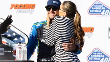 Ryan Blaney (12) gets a kiss from fiancé Gianna Tulio after winning the NASCAR Cup Series on July 14, 2024