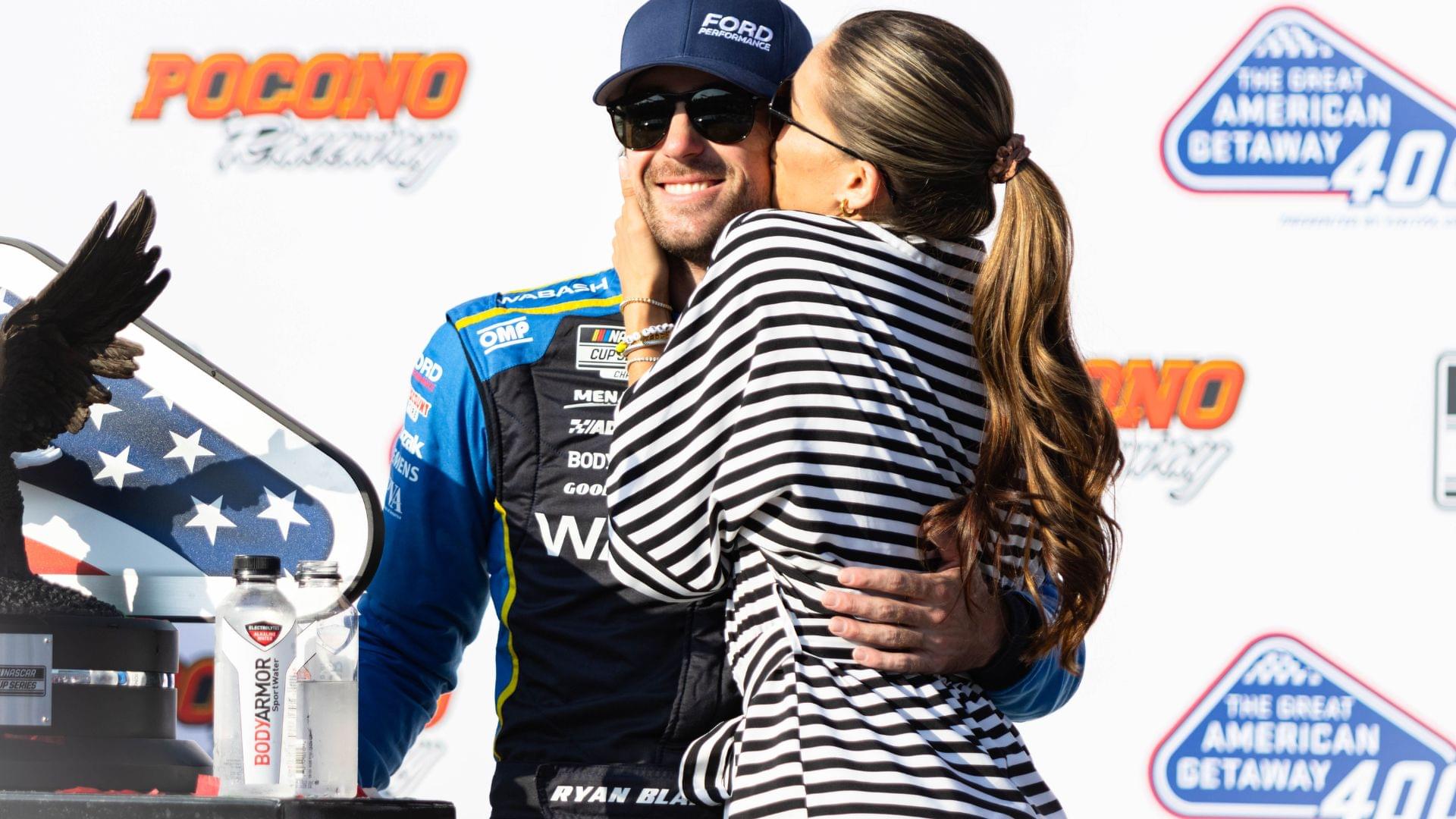 Ryan Blaney (12) gets a kiss from fiancé Gianna Tulio after winning the NASCAR Cup Series on July 14, 2024