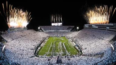 Fireworks burst overhead as the Penn State Nittany Lions take the field prior to a White Out game against the Washington Huskies at Beaver Stadium.