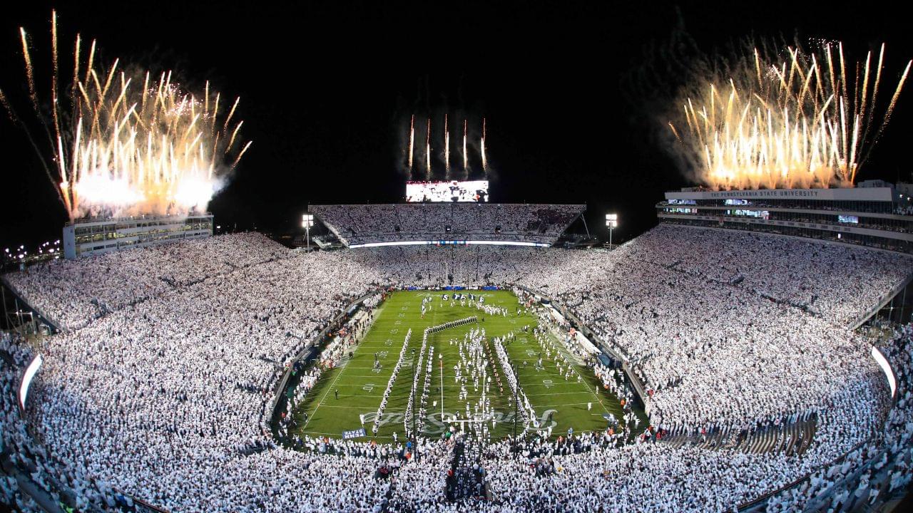 Fireworks burst overhead as the Penn State Nittany Lions take the field prior to a White Out game against the Washington Huskies at Beaver Stadium.