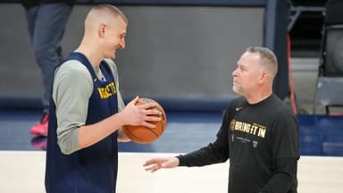 May 31, 2023; Denver, CO, USA; Denver Nuggets center Nikola Jokic (15) talks with head coach Michael Malone during a practice session on media day before the 2023 NBA Finals at Ball Arena.