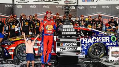 NASCAR Cup Series driver Chase Briscoe (19) celebrates his win with his son Brooks at the Cook Out Southern 500 at Darlington Raceway.