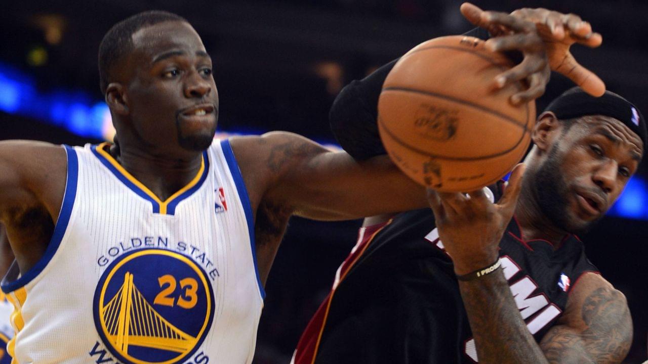 The Golden State Warriors Draymond Green (23) and the Miami Heat LeBron James battle for the ball under the Warriors basket in the second quarter at Oracle Arena in Oakland, California,