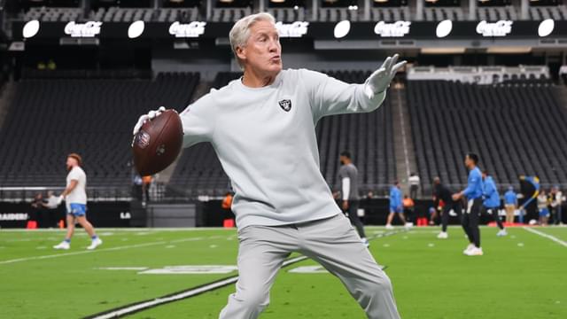 Las Vegas Raiders head coach Pete Carroll throws a ball before the game against the Los Angeles Chargers at Allegiant Stadium.