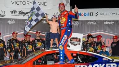 NASCAR Cup Series driver Chase Briscoe (19) and his son Brooks celebrates his win at the Cook Out Southern 500 at Darlington Raceway.