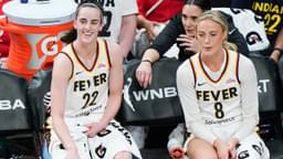 Indiana Fever guards Caitlin Clark (22)(L) and Sophie Cunningham (8) on the sidelines during the game against the Connecticut Sun