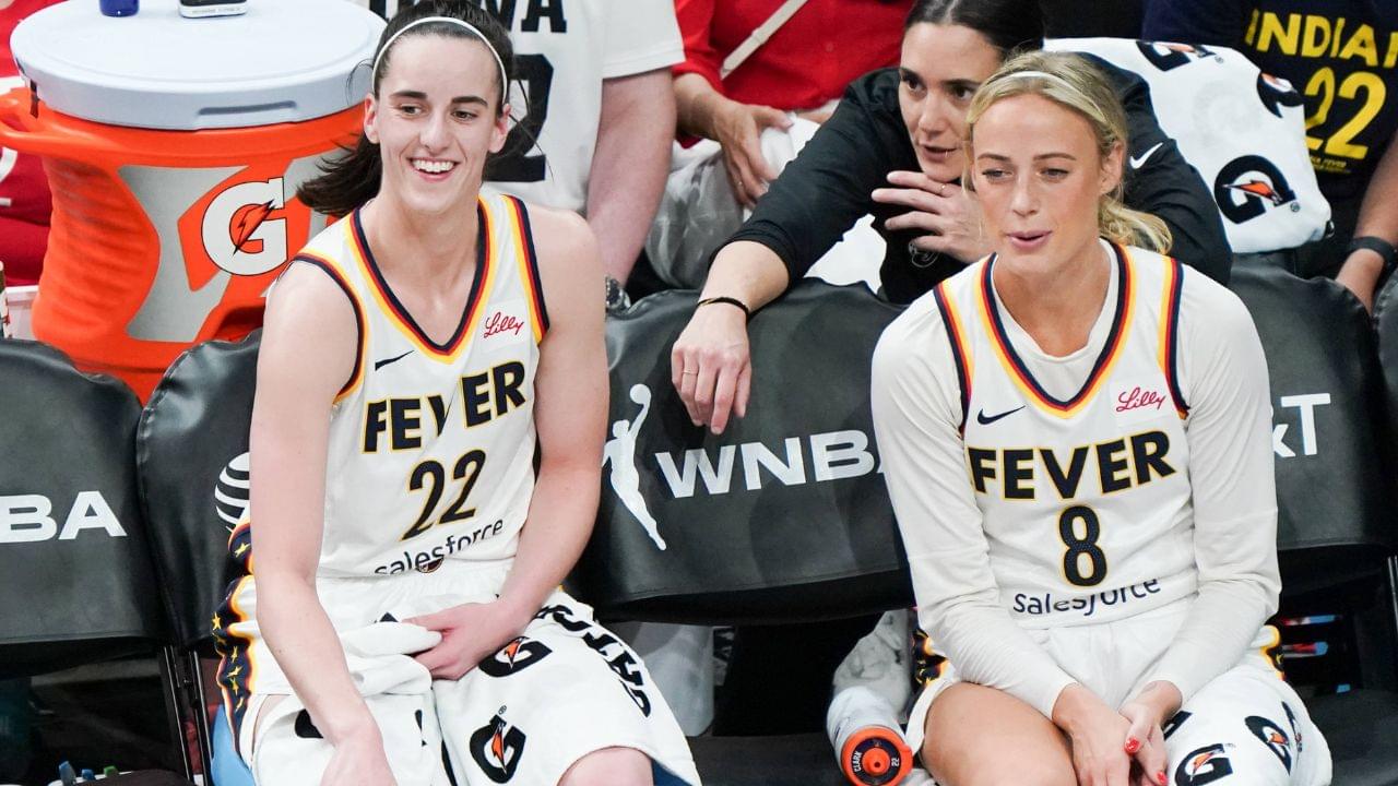 Indiana Fever guards Caitlin Clark (22)(L) and Sophie Cunningham (8) on the sidelines during the game against the Connecticut Sun