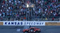 Sep 29, 2024; Kansas City, Kansas, USA; NASCAR Cup Series driver Ross Chastain (1) crosses the finish line to win the Hollywood Casino 400 at Kansas Speedway.