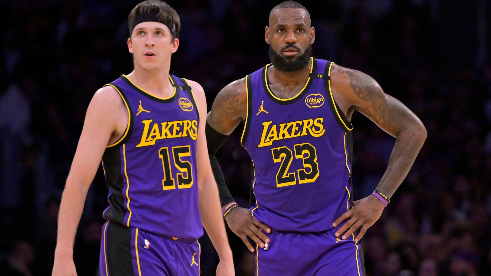 Jan 17, 2025; Los Angeles, California, USA; Los Angeles Lakers guard Austin Reaves (15) and forward LeBron James (23) talk on the court against the Brooklyn Nets at Crypto.com Arena.