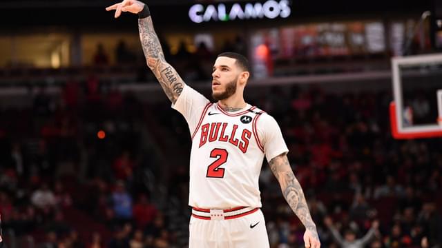 Chicago Bulls forward Lonzo Ball (2) hits a three point shot against Toronto Raptors guard Jamal Shead (23) during overtime at the United Center.