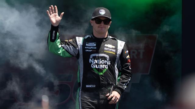 Jul 13, 2025; Sonoma, California, USA; NASCAR Cup Series driver Justin Haley (7) waves after being introduced to fans before the start of the NASCAR Toyota / Save Mart 360 at Sonoma Raceway