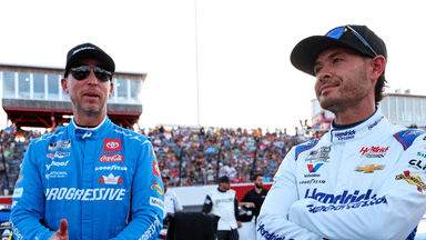 May 18, 2025; North Wilkesboro, North Carolina, USA; NASCAR Cup Series driver Kyle Larson (5) and NASCAR Cup Series driver Denny Hamlin (11) before the NASCAR All-Star Open at North Wilkesboro Speedway. Mandatory Credit: Peter Casey-Imagn Images