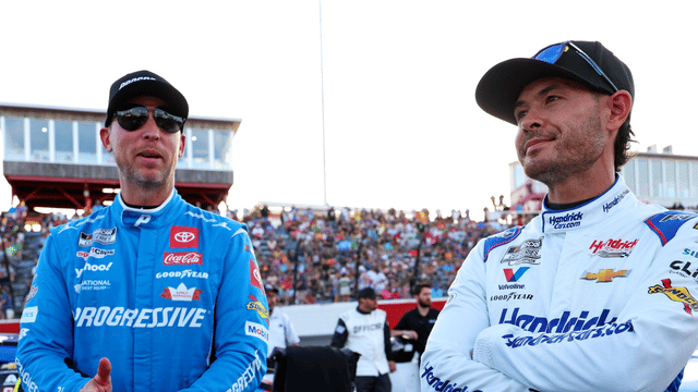 May 18, 2025; North Wilkesboro, North Carolina, USA; NASCAR Cup Series driver Kyle Larson (5) and NASCAR Cup Series driver Denny Hamlin (11) before the NASCAR All-Star Open at North Wilkesboro Speedway. Mandatory Credit: Peter Casey-Imagn Images