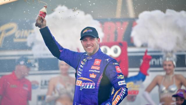 Oct 12, 2025; Las Vegas, Nevada, USA; NASCAR Cup Series driver Denny Hamlin (11) celebrates his victory following the South Point 400 at Las Vegas Motor Speedway.