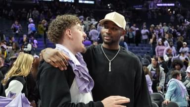 May 16, 2025; San Francisco, California, USA; Golden State Warriors guard Brandin Podziemski (left) and Jonathan Kuminga (right) talk after the game between the Golden State Valkyries and the Los Angeles Sparks at Chase Center. Mandatory Credit: Darren Yamashita-Imagn Images
