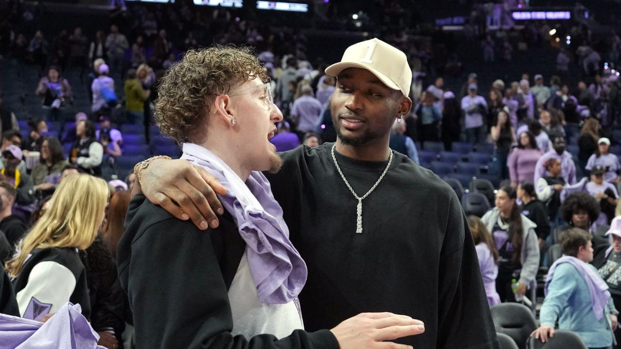 May 16, 2025; San Francisco, California, USA; Golden State Warriors guard Brandin Podziemski (left) and Jonathan Kuminga (right) talk after the game between the Golden State Valkyries and the Los Angeles Sparks at Chase Center. Mandatory Credit: Darren Yamashita-Imagn Images