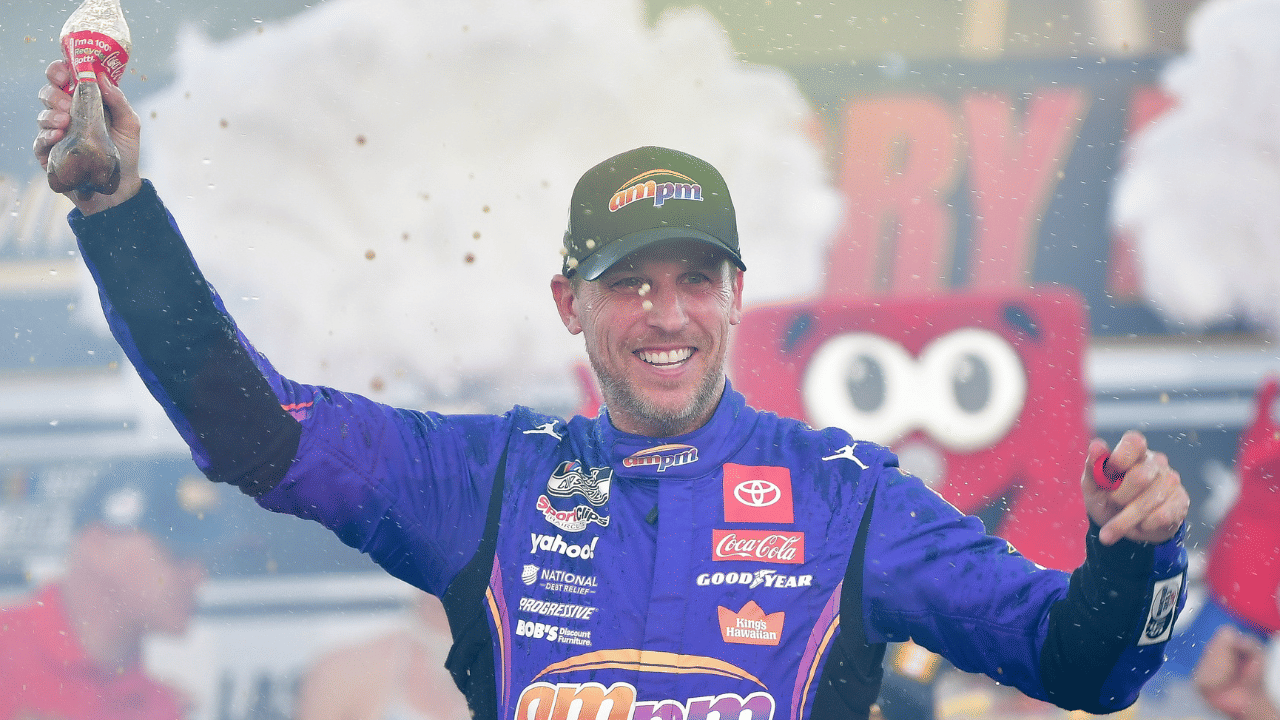 Oct 12, 2025; Las Vegas, Nevada, USA; NASCAR Cup Series driver Denny Hamlin (11) celebrates his victory following the South Point 400 at Las Vegas Motor Speedway. Mandatory Credit: Gary A. Vasquez-Imagn Images