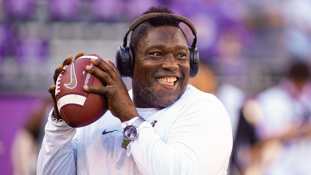 Oct 4, 2025; Fort Worth, Texas, USA; Colorado Buffaloes defensive pass rush coordinator Warren Sapp plays catch on the sidelines prior to a game between the TCU Horned Frogs and the Colorado Buffaloes at Amon G. Carter Stadium.