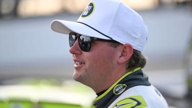 Sep 6, 2025; Madison, Illinois, USA; NASCAR Cup Series driver Noah Gragson (4) looks on during practice and qualifying for the Enjoy Illinois 300 at World Wide Technology Raceway