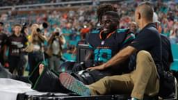 Miami Dolphins wide receiver Tyreek Hill (10) reacts after being placed on a medical cart against the New York Jets during the second half at Hard Rock Stadium.