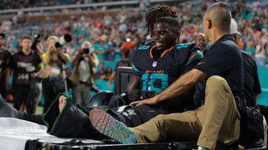 Miami Dolphins wide receiver Tyreek Hill (10) reacts after being placed on a medical cart against the New York Jets during the second half at Hard Rock Stadium.