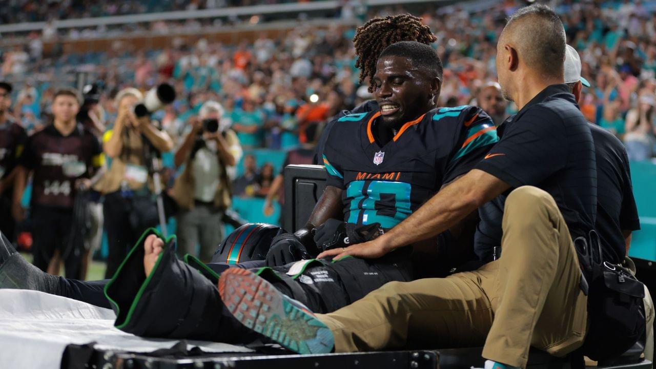 Miami Dolphins wide receiver Tyreek Hill (10) reacts after being placed on a medical cart against the New York Jets during the second half at Hard Rock Stadium.