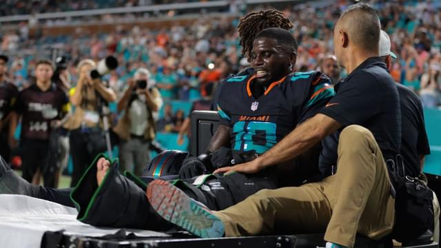Miami Dolphins wide receiver Tyreek Hill (10) reacts after being placed on a medical cart against the New York Jets during the second half at Hard Rock Stadium.