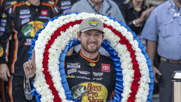 Oct 19, 2025; Talladega, Alabama, USA; NASCAR Cup Series driver Chase Briscoe (19) poses with the victory wreath with Miss Alabama Emma Terry in victory lane at the YellaWood 500 at Talladega Superspeedway. Mandatory Credit: Vasha Hunt-Imagn Images