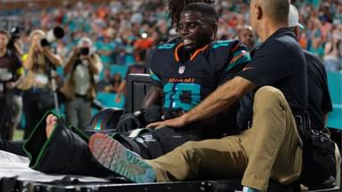 Miami Dolphins wide receiver Tyreek Hill (10) reacts after being placed on a medical cart against the New York Jets during the second half at Hard Rock Stadium.