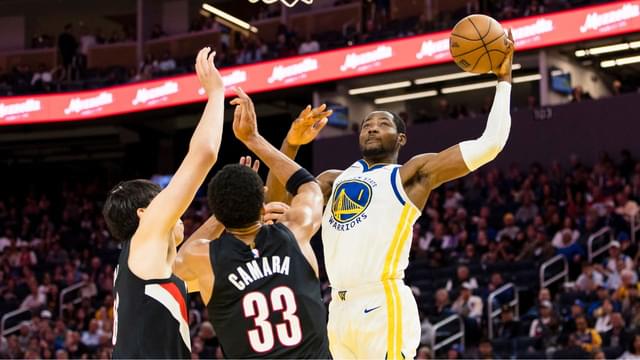 Golden State Warriors forward Jonathan Kuminga (1) shoots as Portland Trail Blazers forward Toumani Camara (33) defends during the third quarter at Chase Center