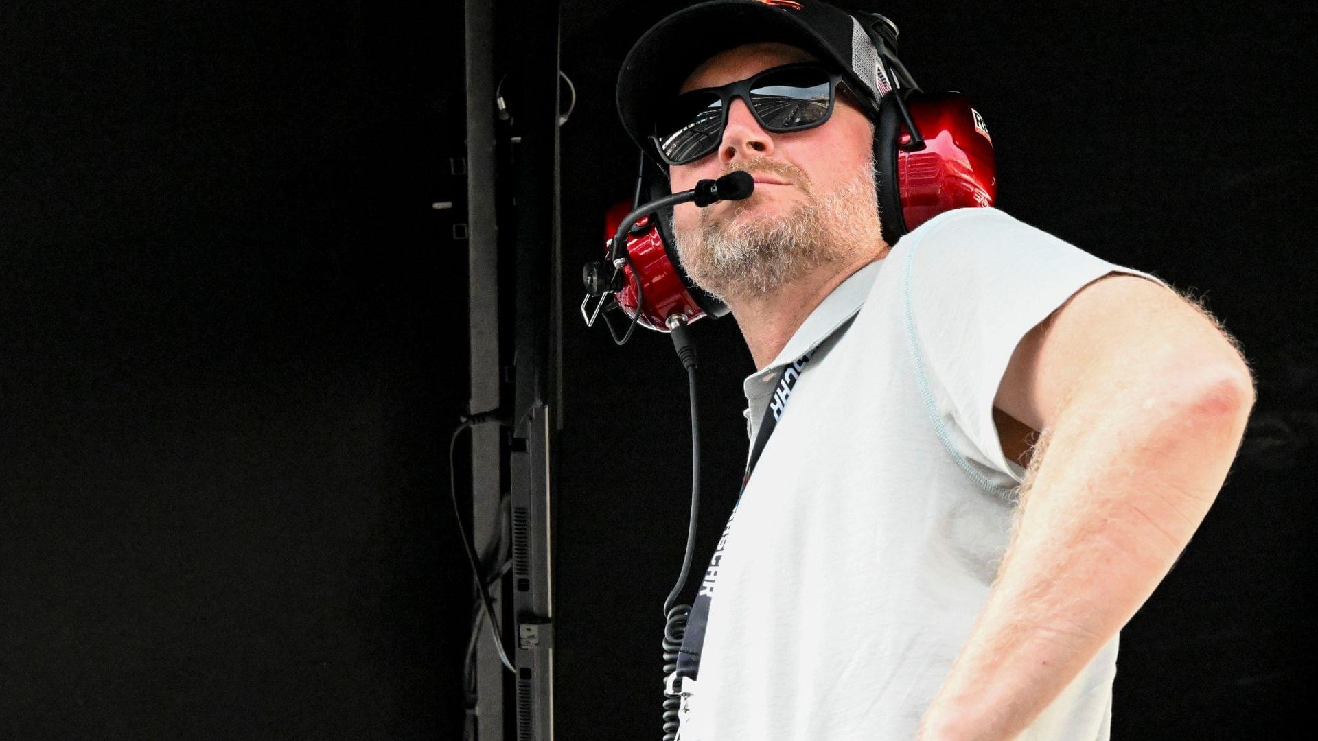Dale Earnhardt Jr. looks out from his pit box Saturday, July 26, 2025, during the Pennzoil 250 at Indianapolis Motor Speedway