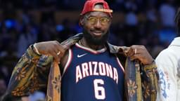 Oct 24, 2025; Los Angeles, California, USA; Los Angeles Lakers forward LeBron James poses in the Arizona Wildcats jersey of his son Bryce James (6) during the game against the Minnesota Timberwolves at Crypto.com Arena.