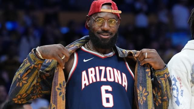 Oct 24, 2025; Los Angeles, California, USA; Los Angeles Lakers forward LeBron James poses in the Arizona Wildcats jersey of his son Bryce James (6) during the game against the Minnesota Timberwolves at Crypto.com Arena.
