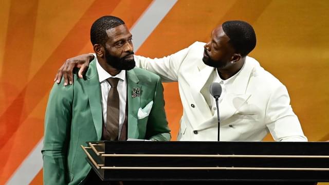 Aug 12, 2023; Springfield, MA, USA; Dwyane Wade (right) calls his father Dwyane Wade Sr. (left) onto the stage at his induction into the 2023 Basketball Hall of Fame at Symphony Hall. Mandatory Credit: Eric Canha-Imagn Images