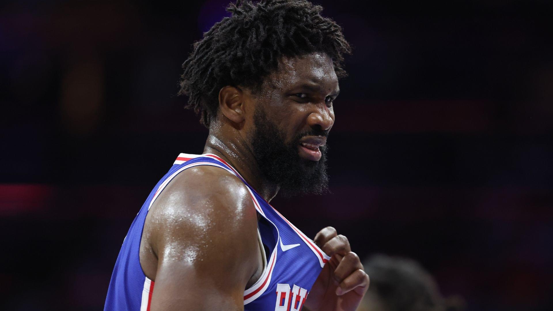 Oct 25, 2025; Philadelphia, Pennsylvania, USA; Philadelphia 76ers center Joel Embiid (21) reacts after being hit in the upper body during the third quarter against the Charlotte Hornets at Xfinity Mobile Arena.
