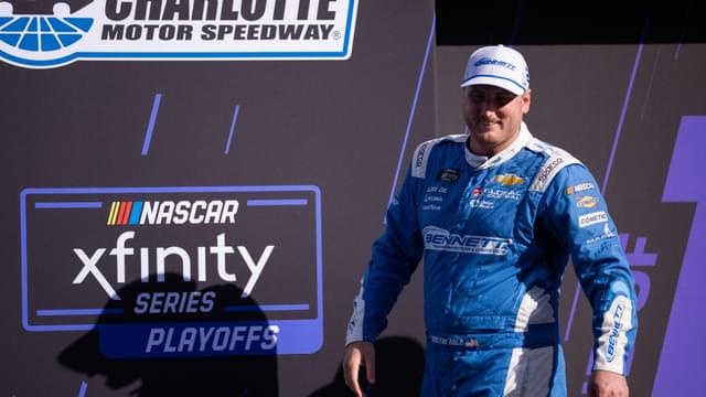 Oct 4, 2025; Concord, North Carolina, USA; NASCAR Xfinity Series driver Austin Hill (21) is introduced at Charlotte Motor Speedway Road Course.