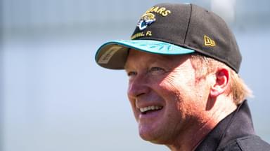 Former NFL Coach Jon Gruden have a laugh while attending an NFL training camp session ten at the Miller Electric Center, Tuesday, Aug. 5, 2025, in Jacksonville, Fla.