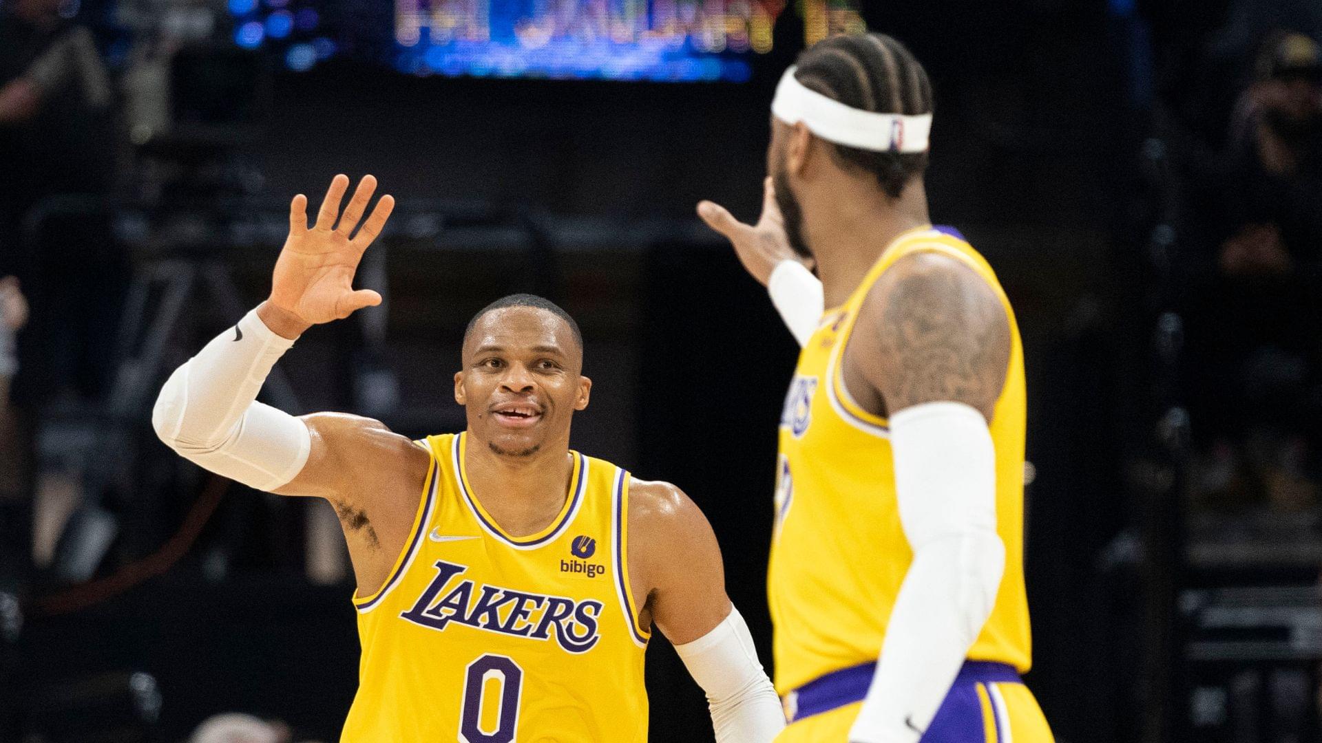 November 30, 2021; Sacramento, California, USA; Los Angeles Lakers guard Russell Westbrook (0) celebrates with forward Carmelo Anthony (7) during the third quarter against the Sacramento Kings at Golden 1 Cente