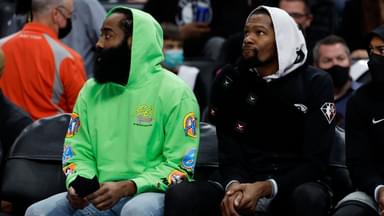 Brooklyn Nets guard James Harden (left) and forward Kevin Durant (right) sit on the bench in the first half against the Detroit Pistons at Little Caesars Arena.
