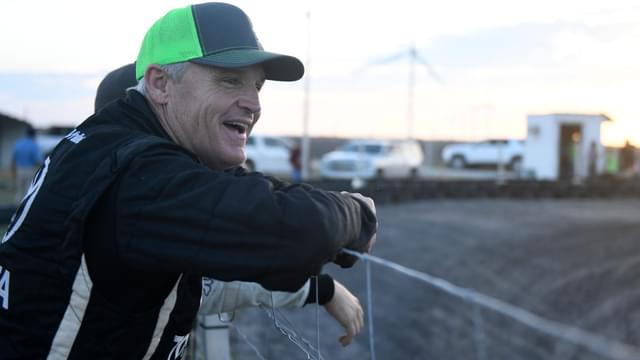 Former NASCAR driver Kenny Wallace watches the kids go-cart race