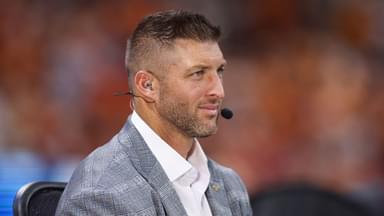SEC Network analyst Tim Tebow on the field before a game between the Tennessee Volunteers and Syracuse Orange at Mercedes-Benz Stadium.