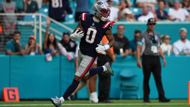 New England Patriots cornerback Christian Gonzalez (0) runs the ball for a touchdown after recovering a fumble against the Miami Dolphins during the second half at Hard Rock Stadium.