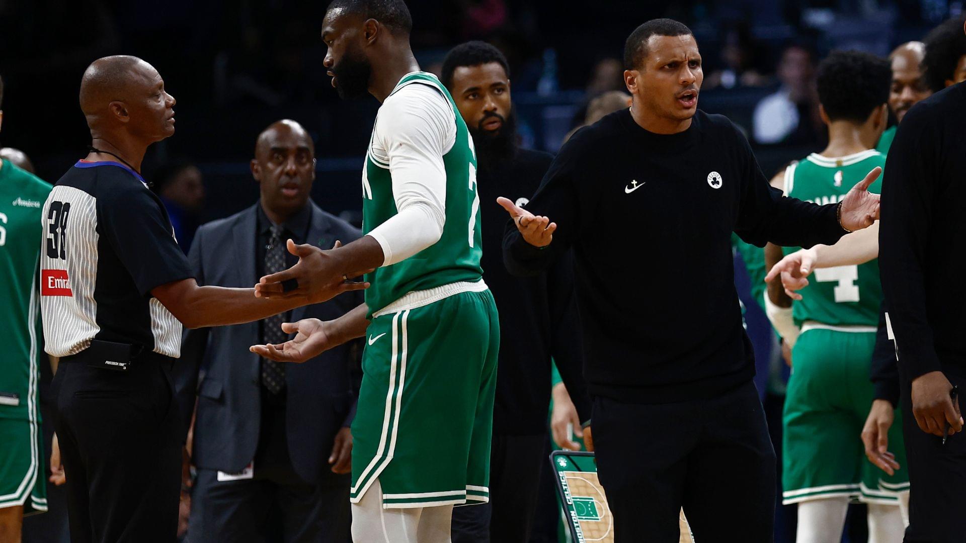 Oct 22, 2025; Boston, Massachusetts, USA; As Boston Celtics guard Jaylen Brown (7) talks with referee Michael Smith (38), head coach Joe Mazzulla gestures towards another official after Brown was called for a charge during the second half against the Philadelphia 76ers at TD Garden