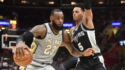 Feb 25, 2018; Cleveland, OH, USA; Cleveland Cavaliers forward LeBron James (23) drives to the basket against San Antonio Spurs guard Dejounte Murray (5) during the first half at Quicken Loans Arena.