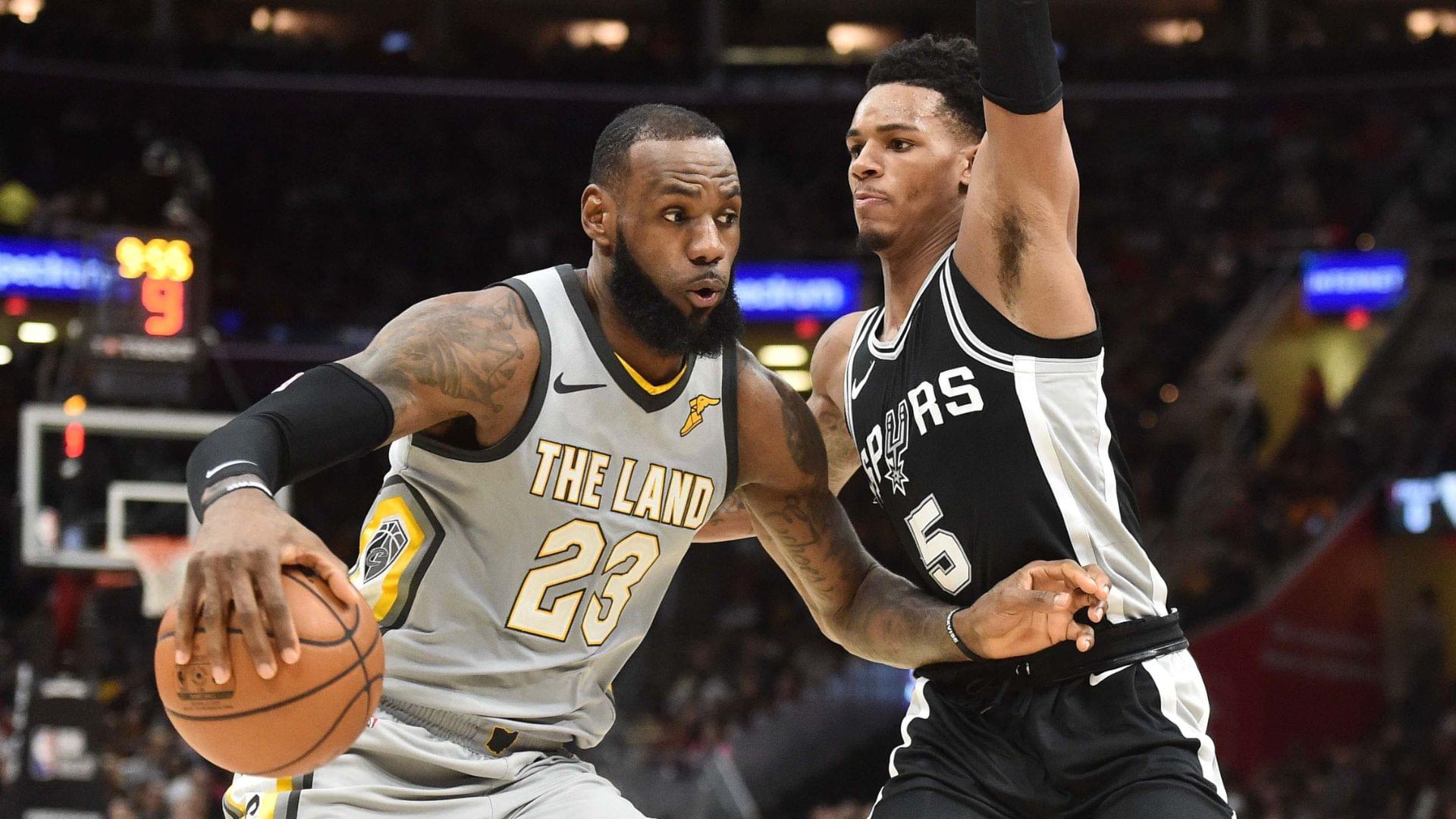 Feb 25, 2018; Cleveland, OH, USA; Cleveland Cavaliers forward LeBron James (23) drives to the basket against San Antonio Spurs guard Dejounte Murray (5) during the first half at Quicken Loans Arena.