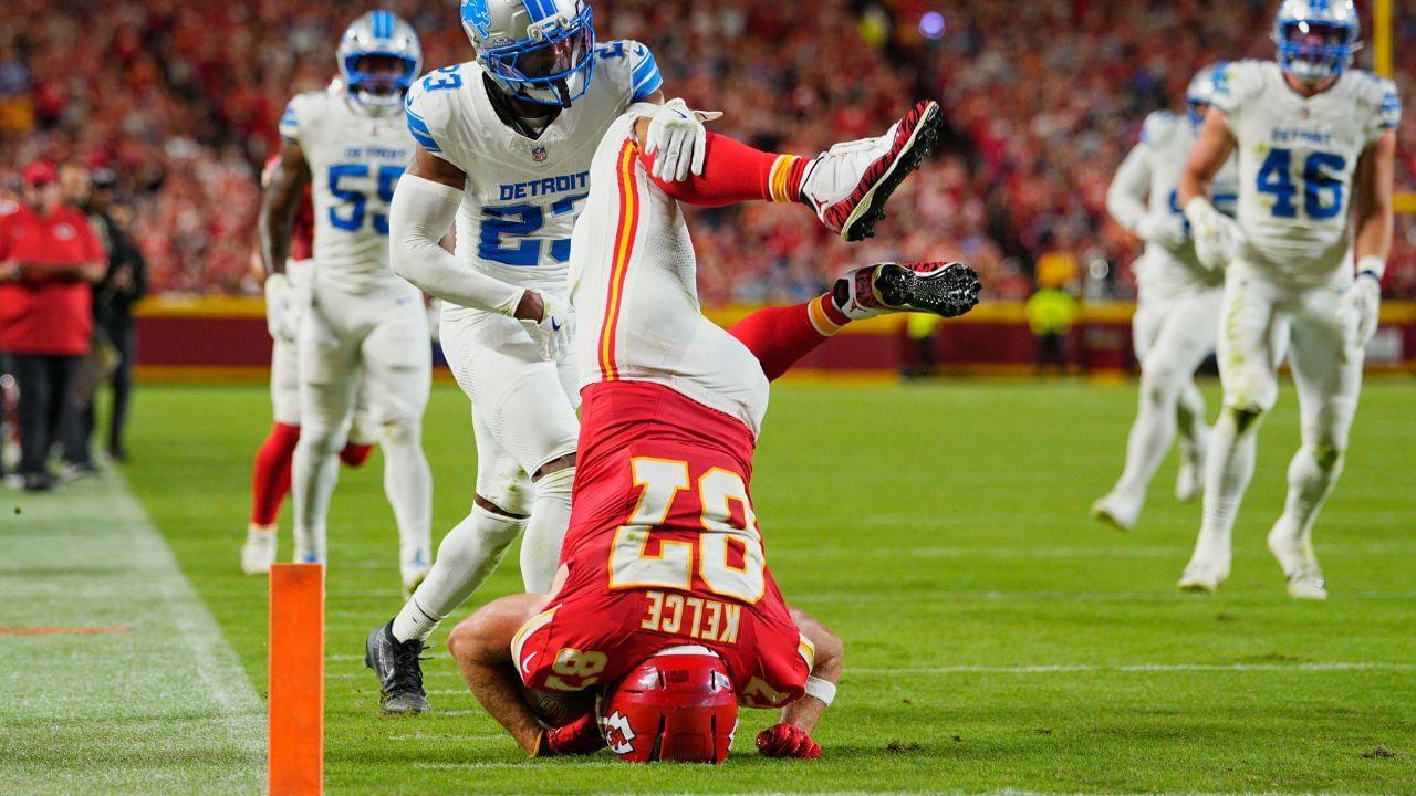 Kansas City Chiefs tight end Travis Kelce (87) leaps over Detroit Lions cornerback Rock Ya-Sin (23) against the Detroit Lions during the first half at GEHA Field at Arrowhead Stadium.
