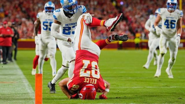 Kansas City Chiefs tight end Travis Kelce (87) leaps over Detroit Lions cornerback Rock Ya-Sin (23) against the Detroit Lions during the first half at GEHA Field at Arrowhead Stadium.