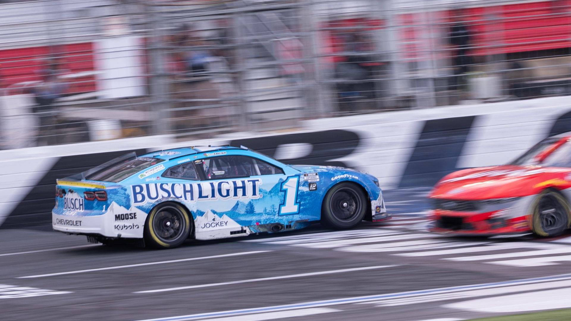 Oct 5, 2025; Concord, North Carolina, USA; NASCAR Cup Series driver Ross Chastain (1) backs across the finish line at Charlotte Motor Speedway Road Course