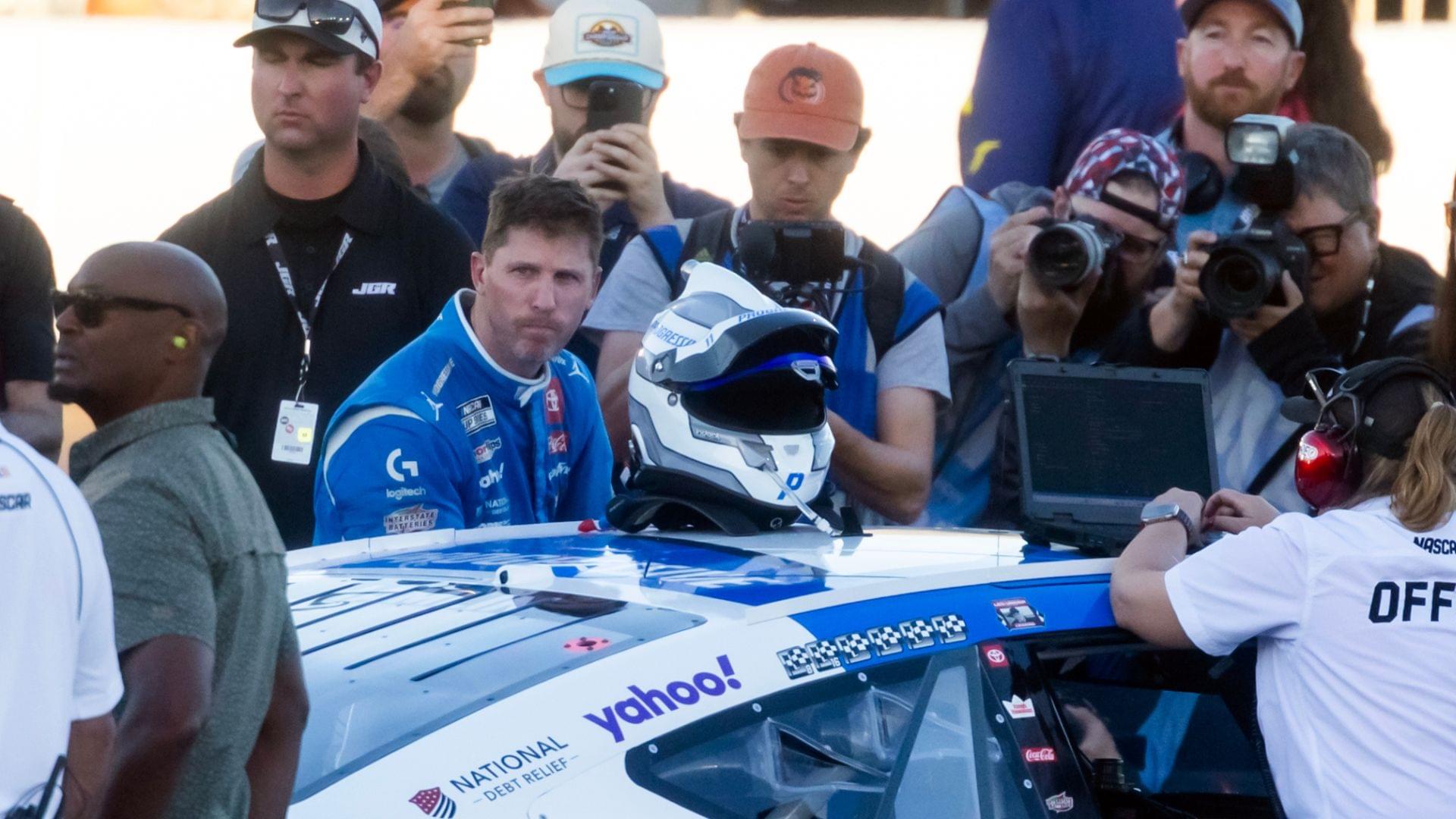 Nov 2, 2025; Avondale, Arizona, USA; NASCAR Cup Series driver Denny Hamlin (11) reacts after climnbing out of his car following the NASCAR Championship race at Phoenix Raceway.