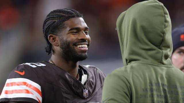 Cleveland Browns quarterback Shedeur Sanders (12) is all smiles as he chats on the sideline during the second half of an NFL football game at Huntington Bank Field, Nov. 16, 2025, in Cleveland, Ohio.
